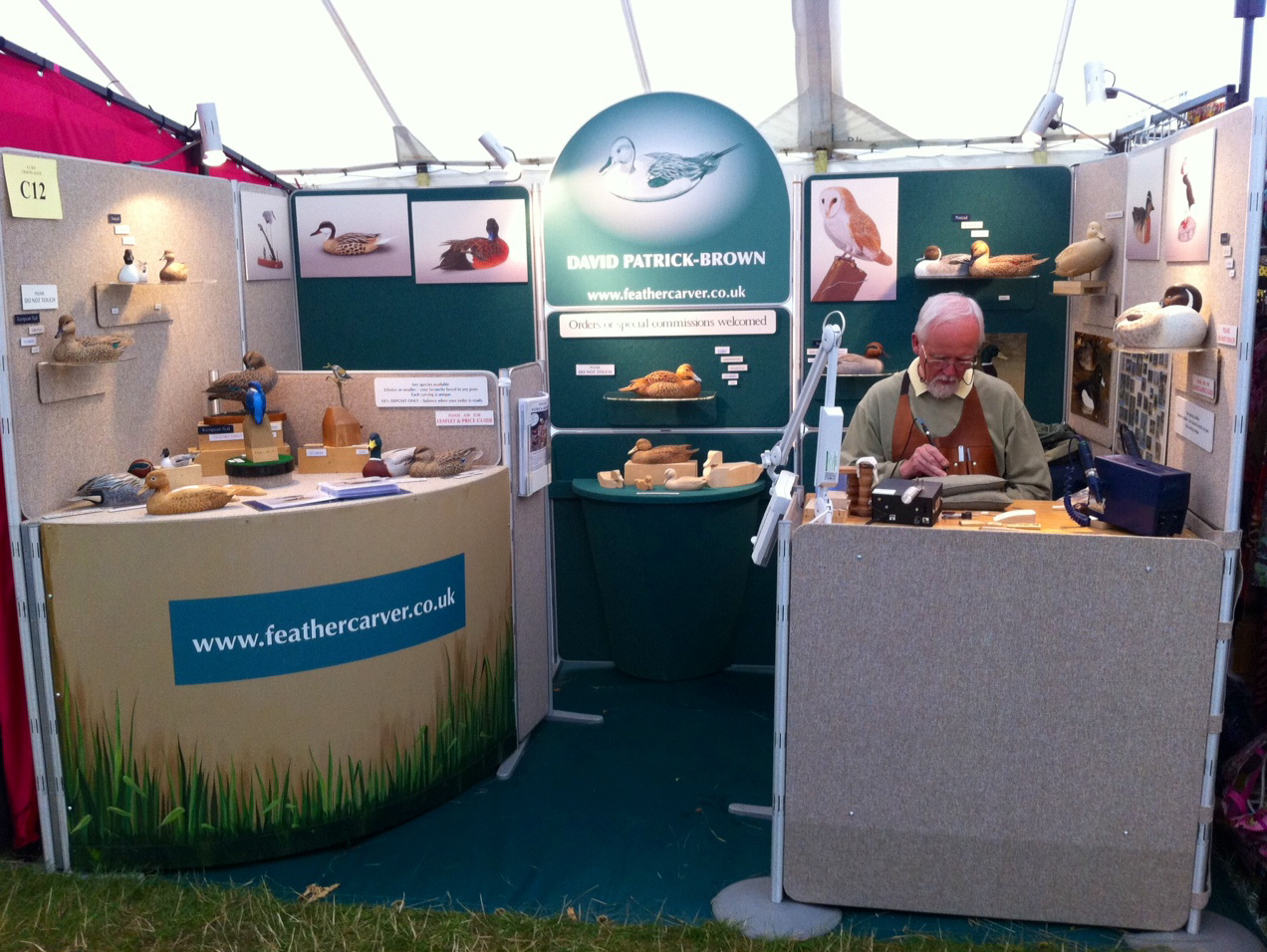 Feathercarver David Patrick-Brown working on his show stand